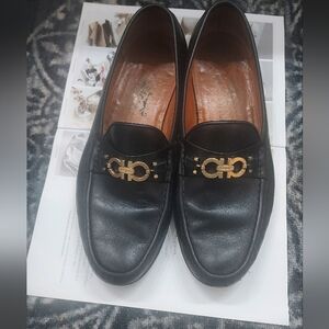 Salvatore Ferragamo Black and Gold Loafers with Signature Hardware